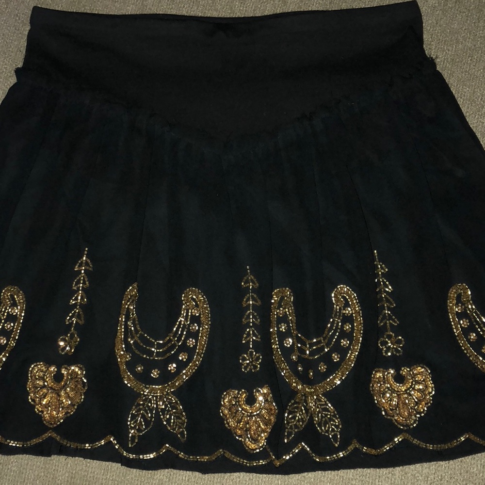 Free People black skirt with gold beading.